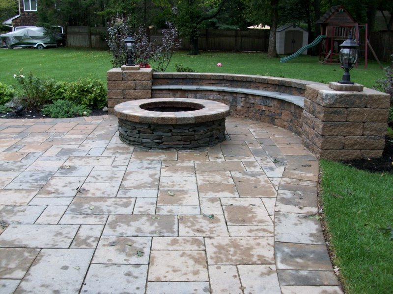 fire pit patio with seating wall